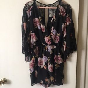 Short jumpsuit black lace detail looks so nice on. In good condition.